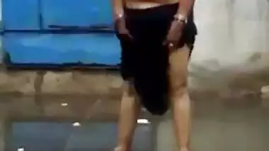 Topless matured aunty enjoying rain