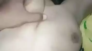 Guy squeezes a 19-year-old nude girl’s juicy boobs