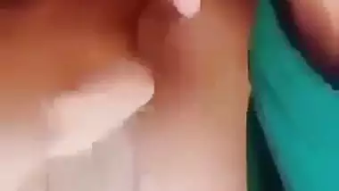 Horny girl squeezes her boobs and fingers her hairy pussy