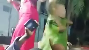 Excited Desi girl with fake XXX boobs dances outdoors during party