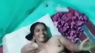Village sex of a wife putting a condom on dick before sex