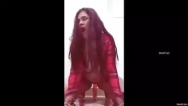 Solo Desi MILF with chubby body teases her twat with a long dildo
