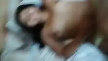 Desi girl keenly lies in bed exposing small XXX boobs on camera