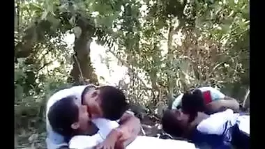 College couples enjoying outdoor kissing infront of their allies